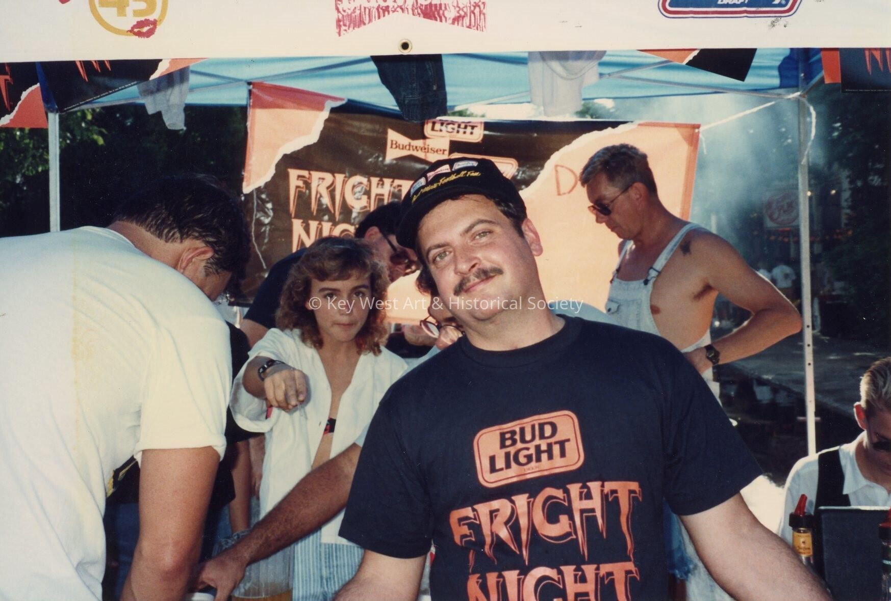 An unknown man at a booth.