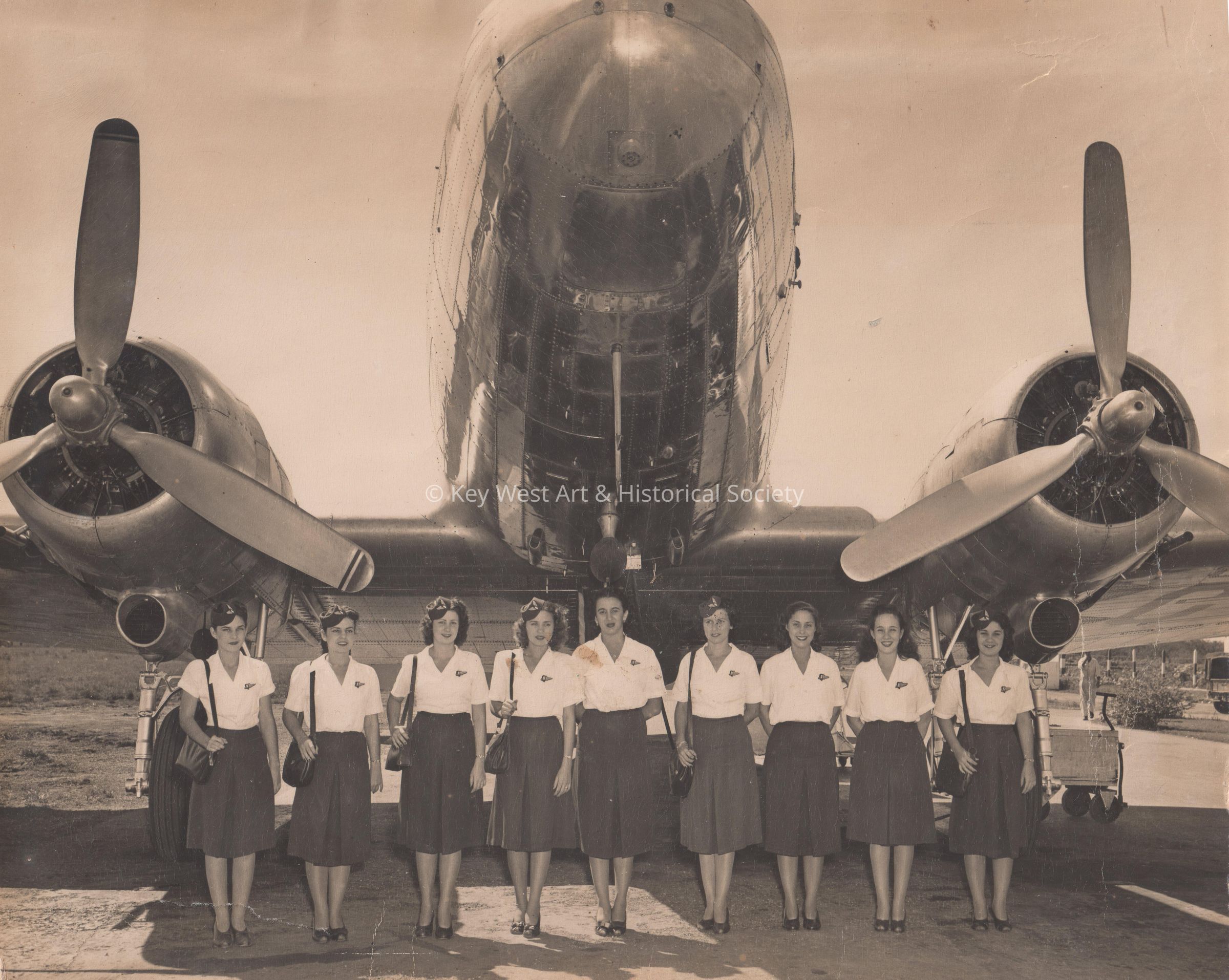 Flight attendants with plane picture number 1