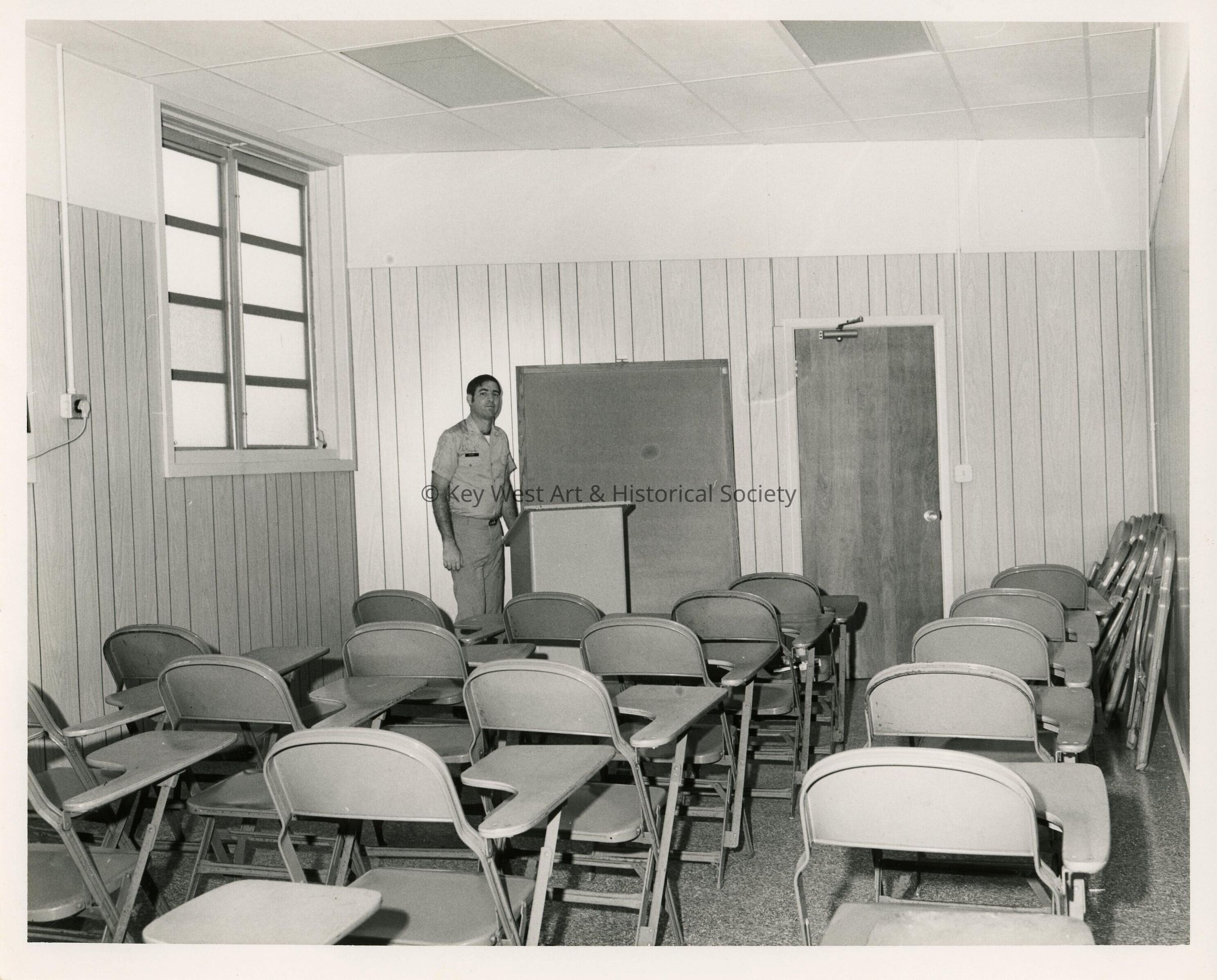 An unknown man in a classroom