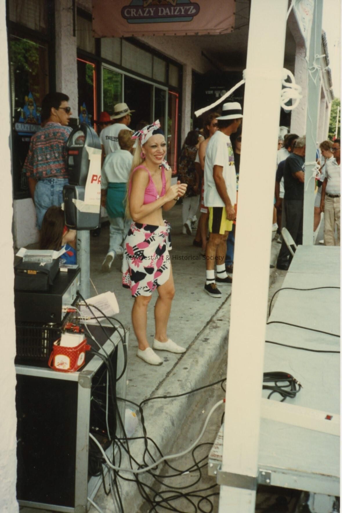 An unknown lady standing outside of CrazyDaizy'z.