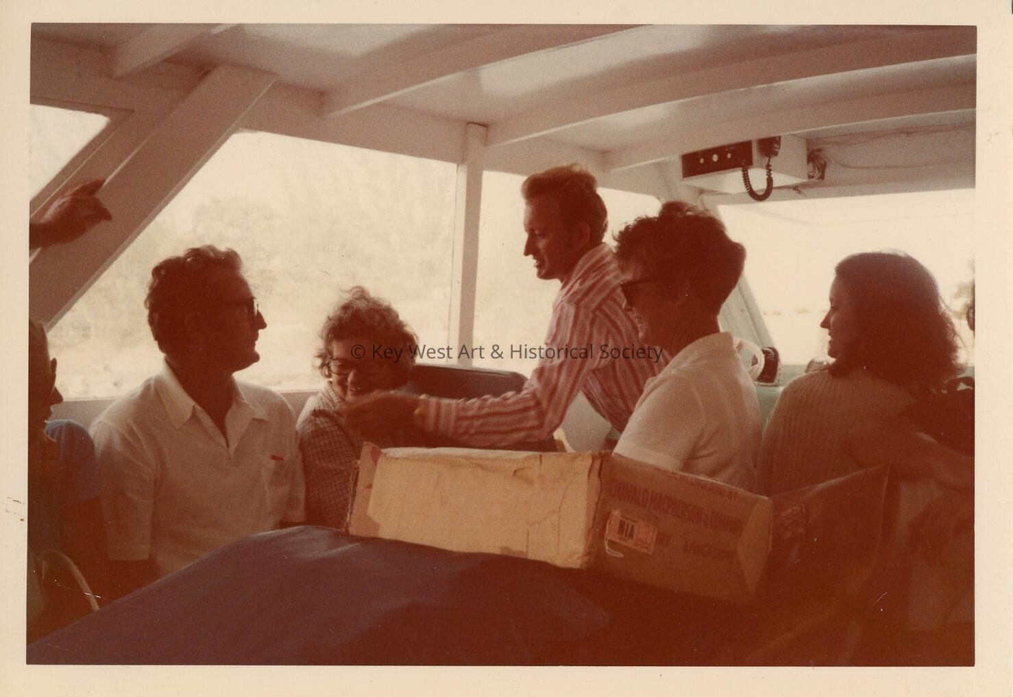 A group of unknown people on a boat