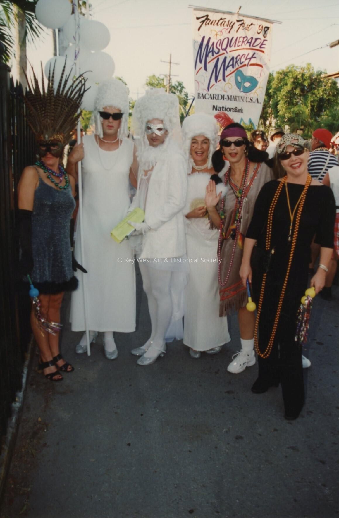 A group of unknown people dressed up.