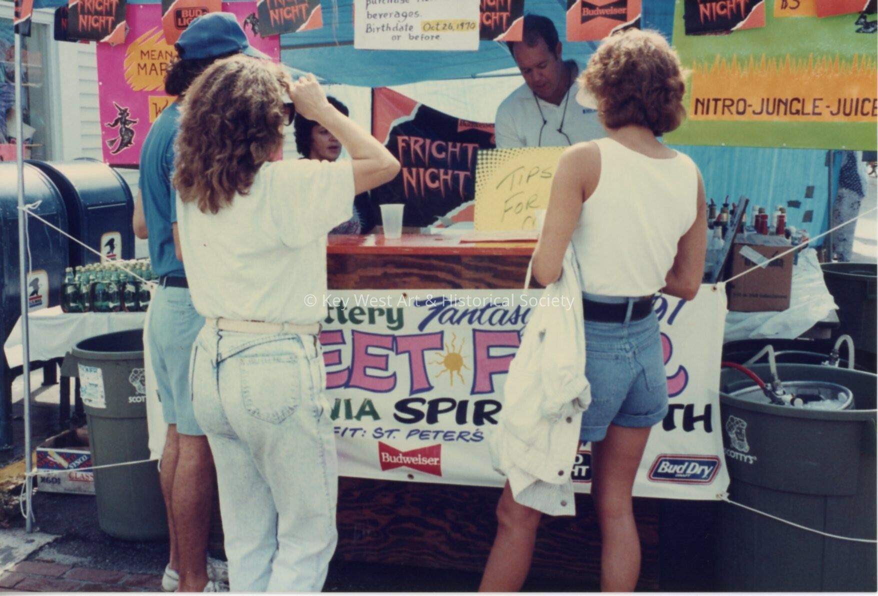 A few unknown people at the Florida lottery street fair booth.