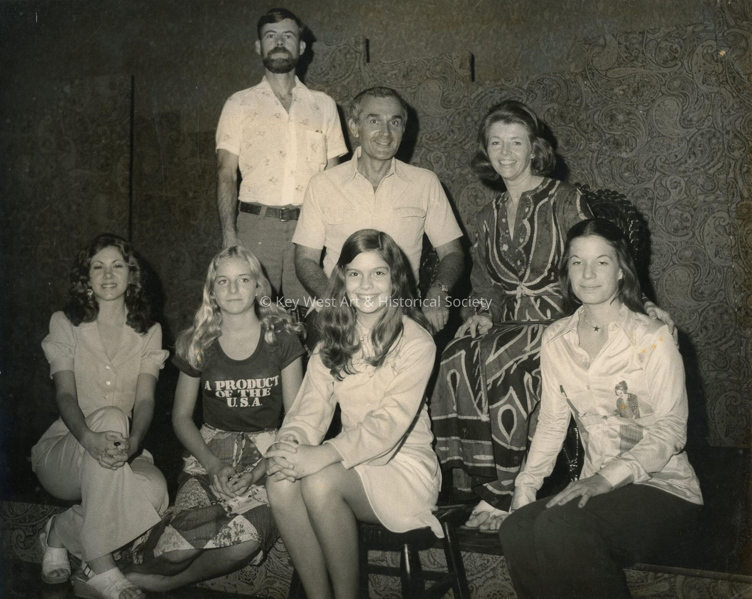 A group of unknown people posing for a photograph