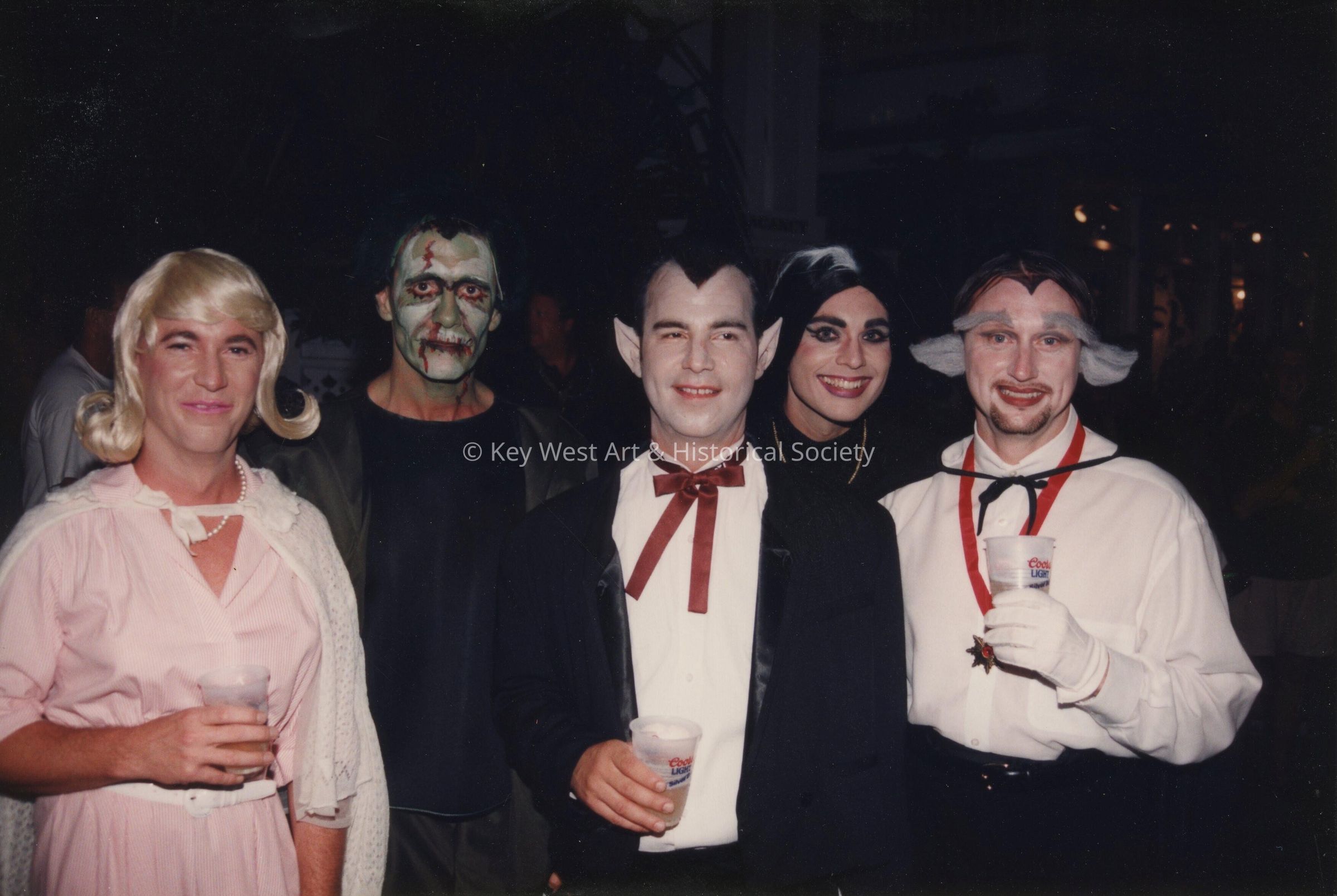 A group of unknown people dressed up.