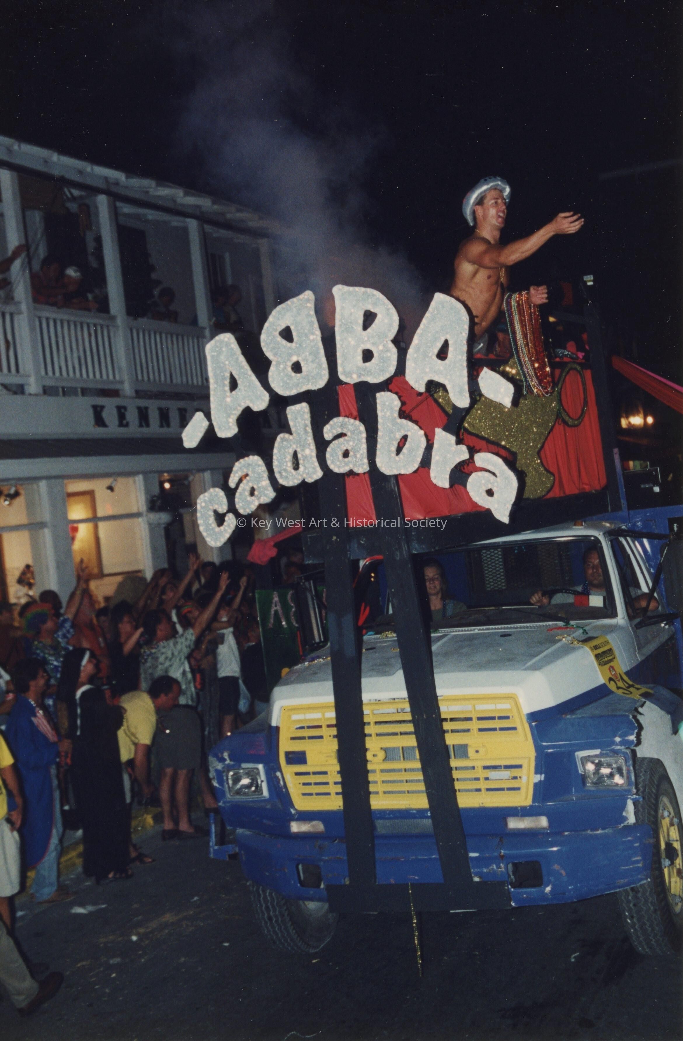 A float in the parade that reads Abba cadabra.
