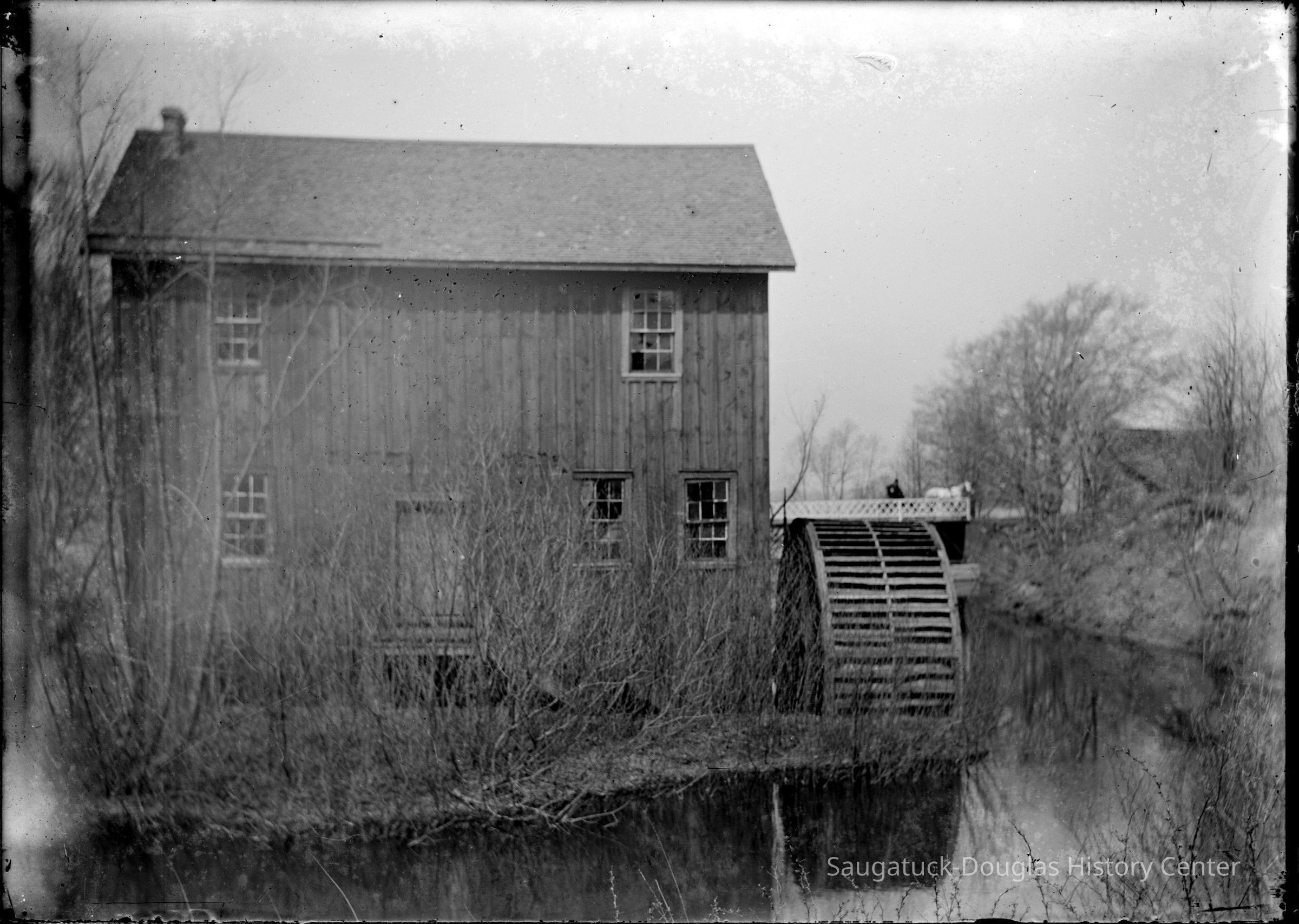 Deam13.jpg 832KB; the mill at Pier Cove with bridge in the background
