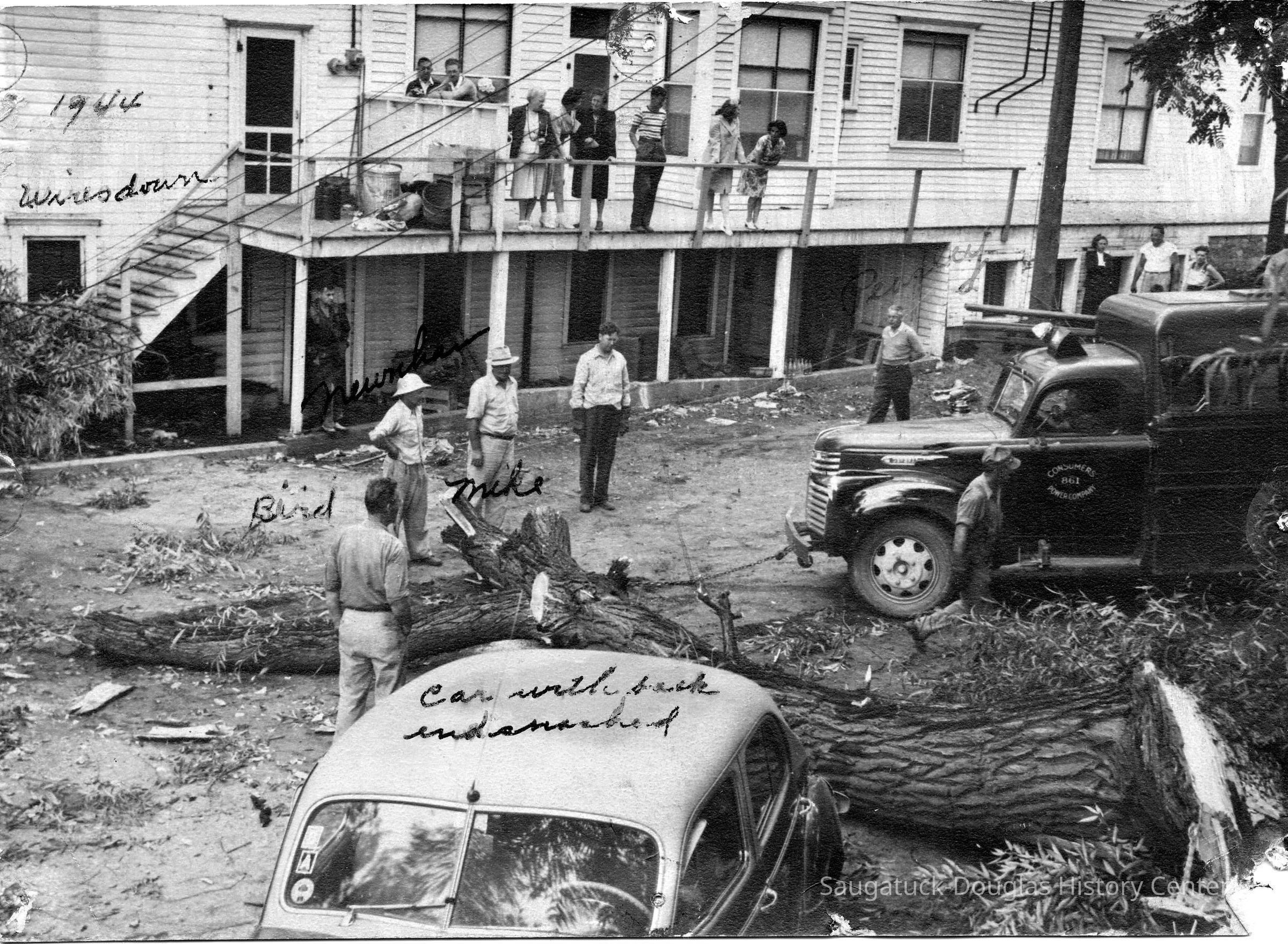          89-1-114_Storm_Damage.jpg 973KB; Car with back end smashed, Bird, Mike, Peasley? Peavey? 1944 Wires down, east facade.
   
