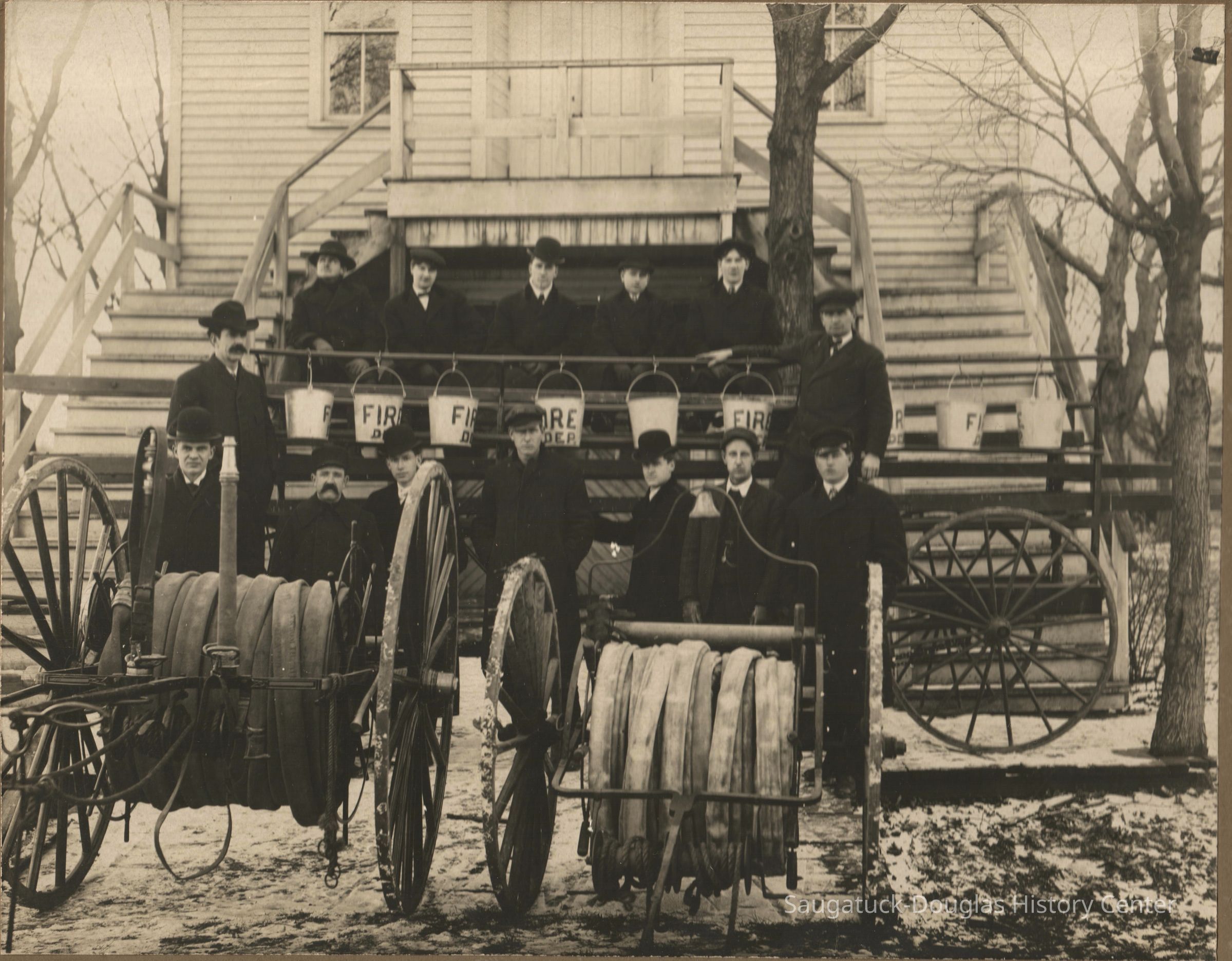 Saugatuck-fire-co-abt1905.jpg 3.2MB; digital image from James Faasen, Aug. 2023
Saugatuck Fire Brigade circa 1905 in back of village hall
Fire hoses used to fight Koning Hardware/ DL Barber general store fire on north Butler in 1903
Top row
Richard Rode-Fred Walz-Charles Redebauch-Chris Walz-Fred Metzger
Middle
Lee Leland, Jim Davis
Front row
Dr. Davis-Fred Davis-Ira Koning-Charles Bird-Jim Koning-Homer Adams-Herman Hirner