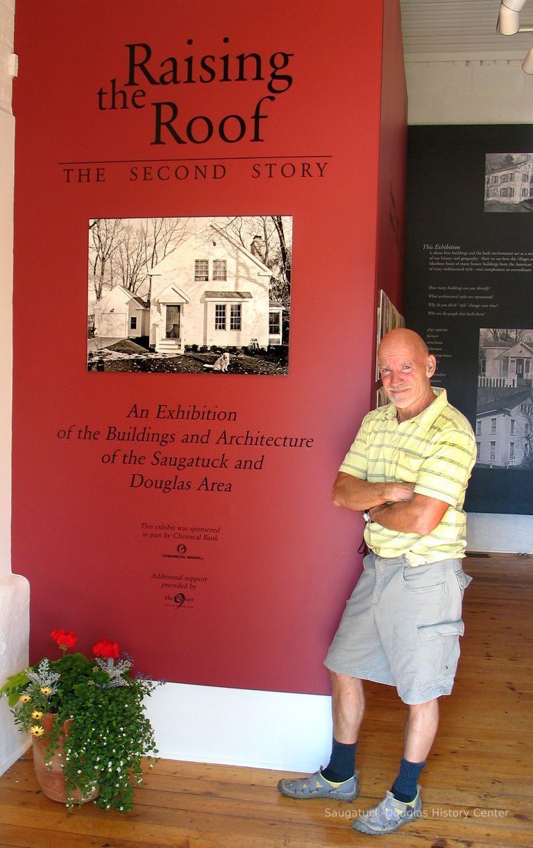          SDHC historian James Schmiechen posed by the intro panel for a 6-29-2006 newspaper story
   