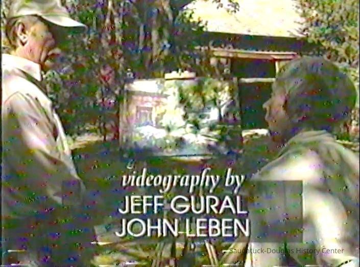 Artist Bob Fagan and homeowner Mary McKamy discuss the finished watercolor painting.