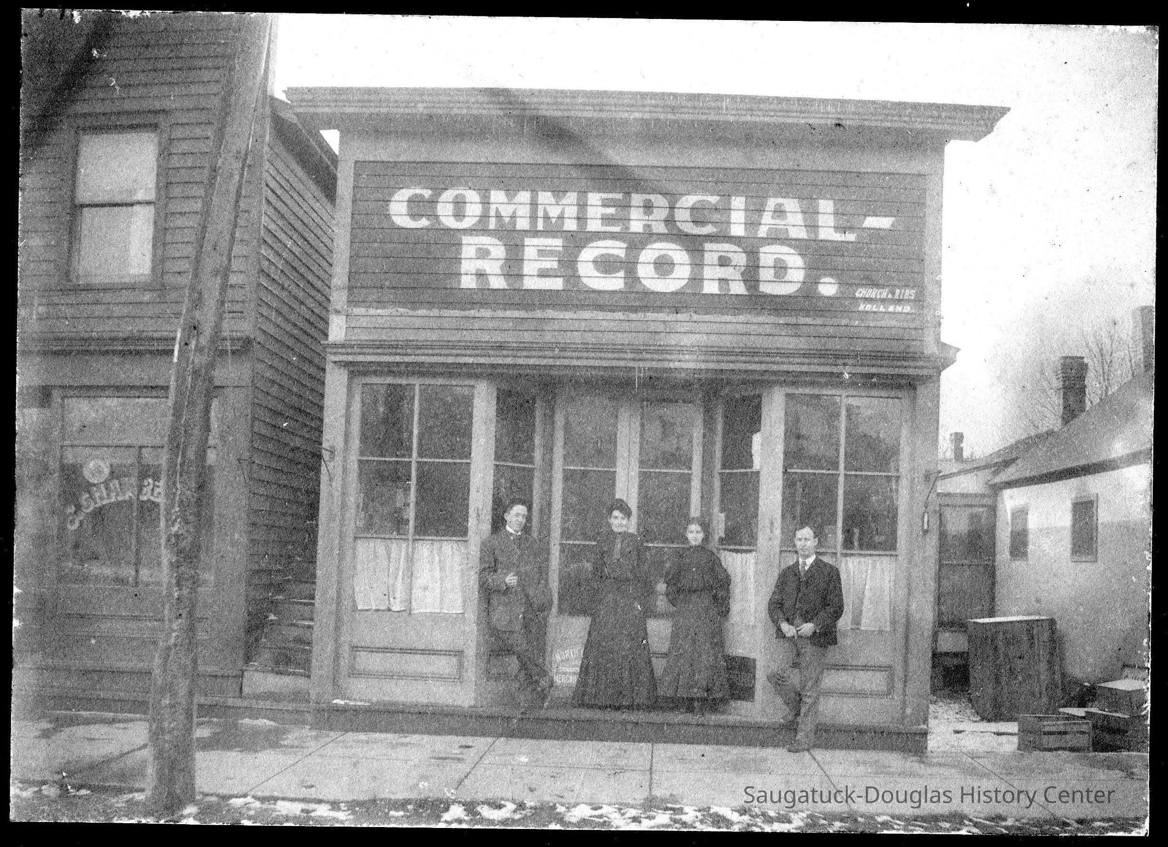 Commercial Record office ca 1890.jpg 2MB Digital file at 2021.72.02 -; This photo was likely taken after 1902 but before 1906 when Heath Block was built next door. Note E. Schaberg Bakery next door