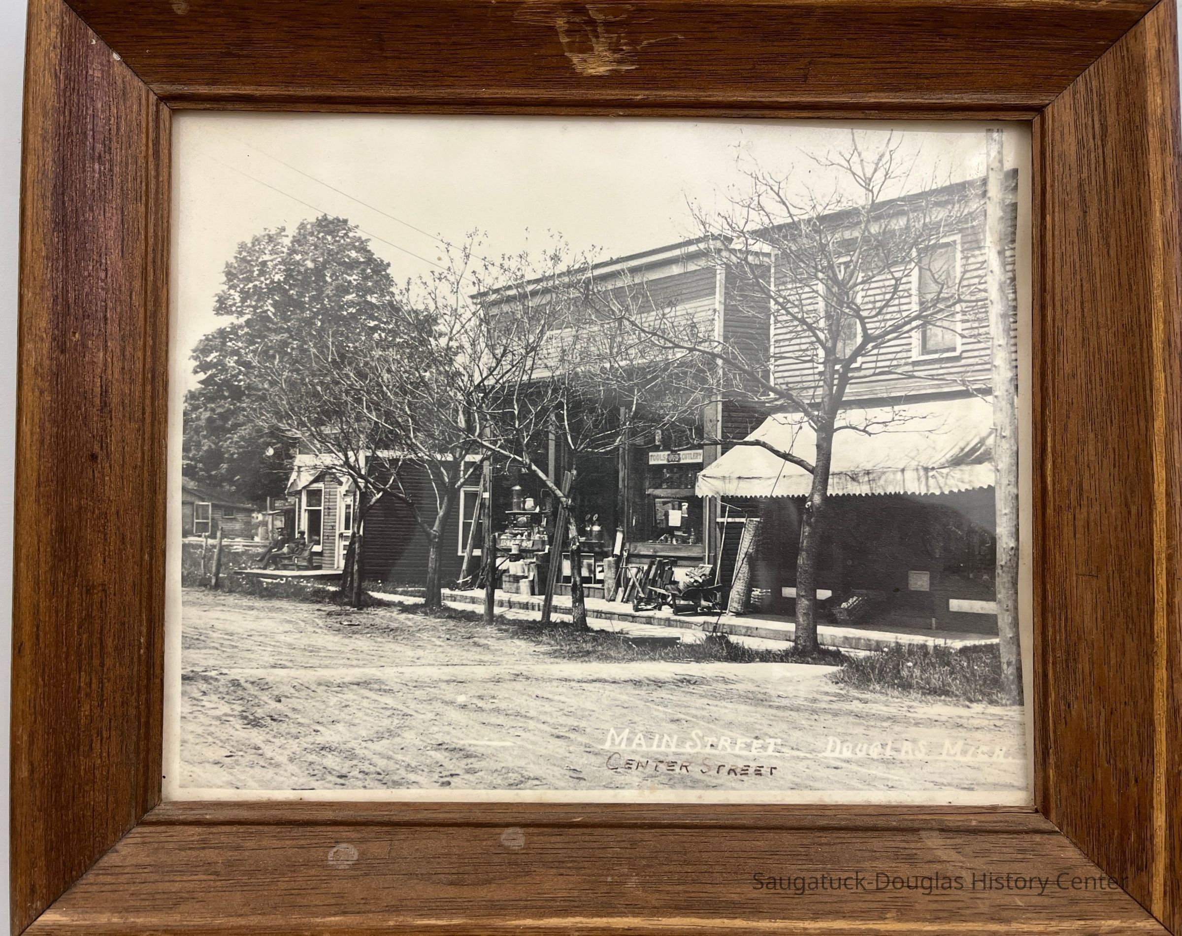          Photo as it arrived in a frame.; Photo has been removed from frame in July 2024 as per conservation best practice.
   