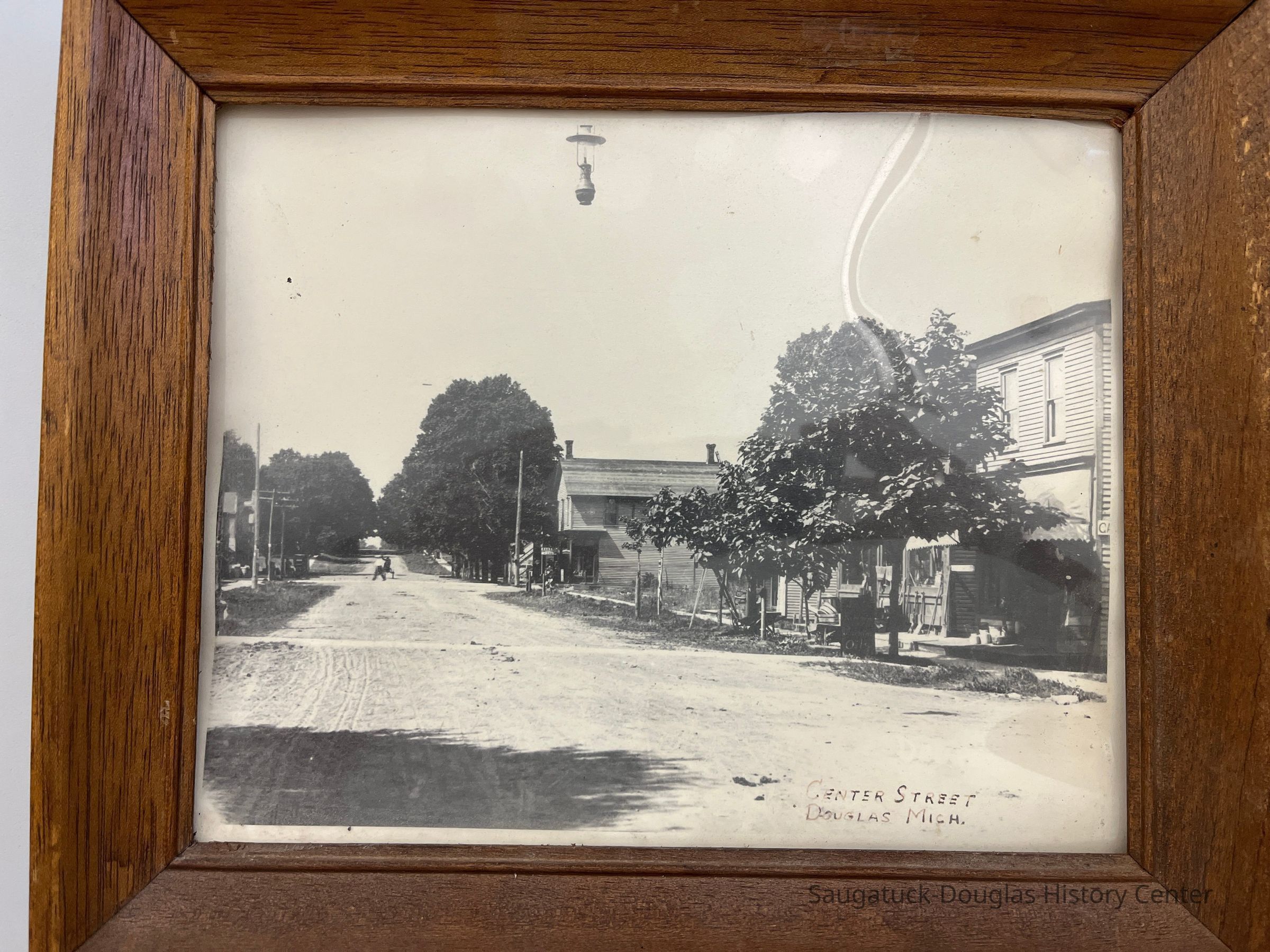          Photo as it arrived in a frame.; Photo was removed from frame in July 2024 as per conservation best practice.
   