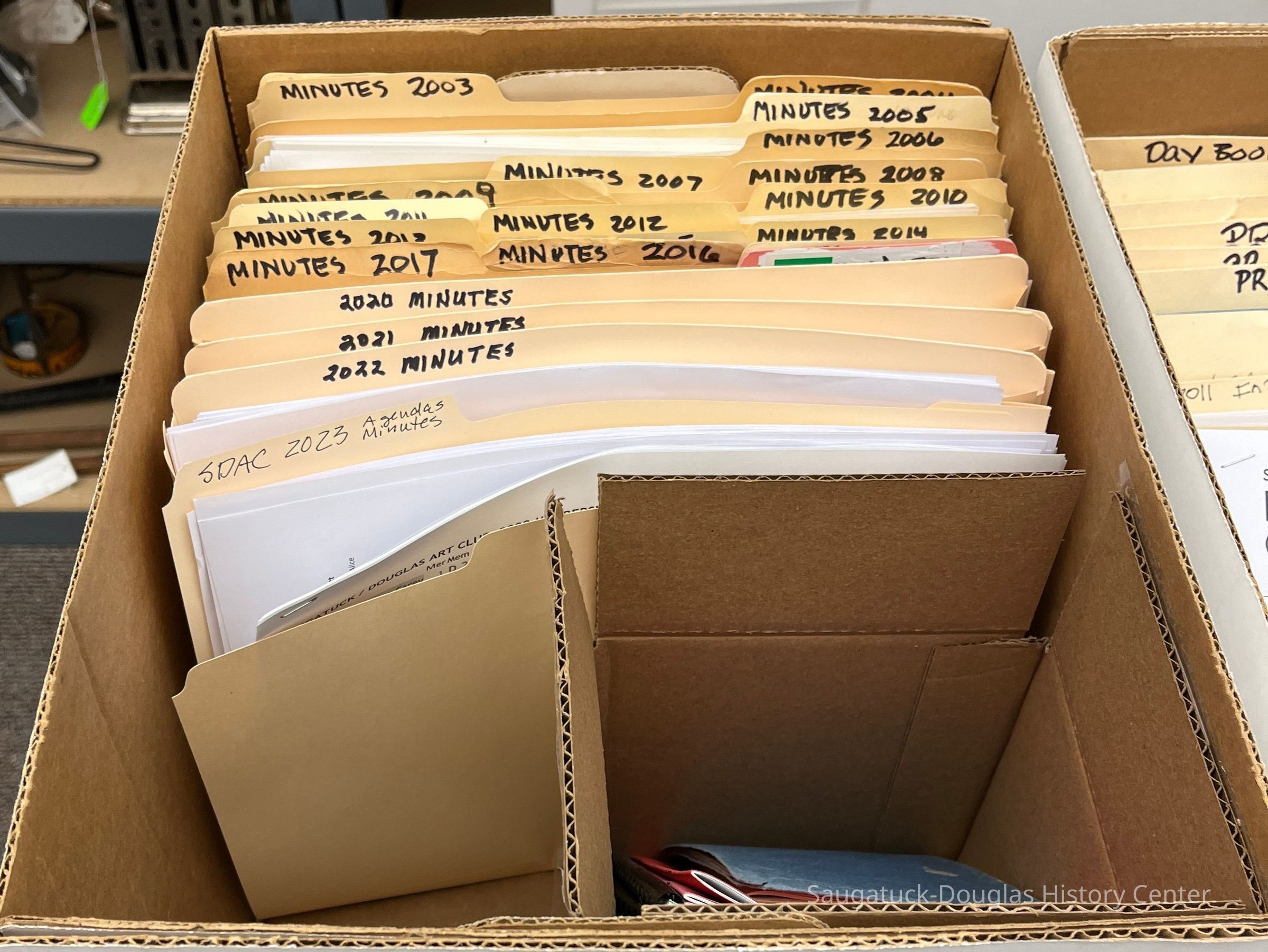 Box 5 contains club minutes from 2002-2023 and a stack of membership directories