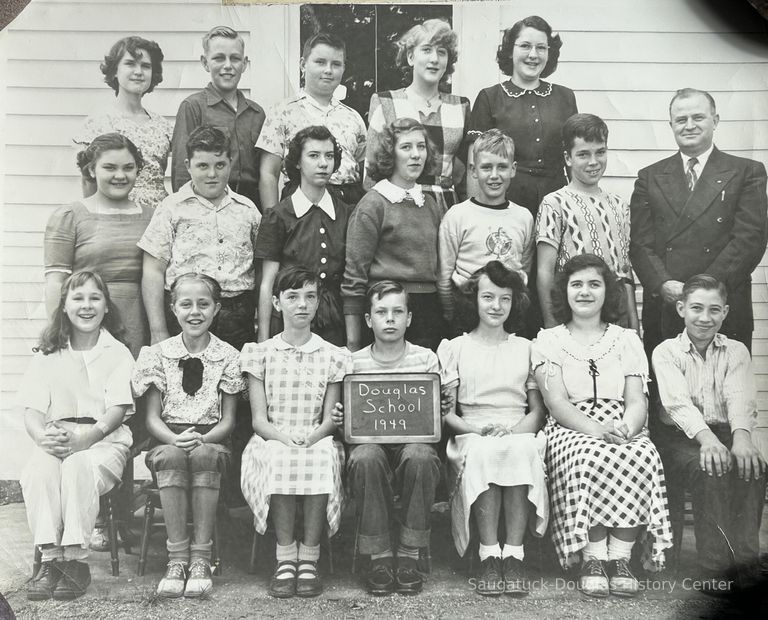          1949; BACK ROW - Jimmy Bruce, Bud Schreckengust, Maggie VanSyckel, Kay Schrenkengust Spencer
MIDDLE - Mary Ash, Earl Herring, Jean and Jane Norman, Harry Forrester, Kim Greene. Teacher Mr. Olmsted
FRONT - Patti Erlewein, Helen Mueller, Ruth Ann Troutman, Mike McVoy, Florence Gooding, Joan Norman, Glenn Gooding
   