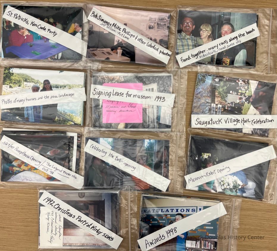 Just some of the photos grouped, roughly, by event and placed in bags by Judy Anthrop.; St. Patrick's Pub Parties, Ken Carls, Bob Simons, Mike Phillips, George Brown, Pat Dewey, Jeff Wilcox, Kit Lane, Mary Ann Curtis, Signing Lease for Museum 1993, Saugatuck Village Hall celebration, Pump house opening, the Legend Theater, Celebrating the return of the Bell, Museum exhibit openings, 1993 Christmas Party at the Kirby, Awards 1998, Picnics