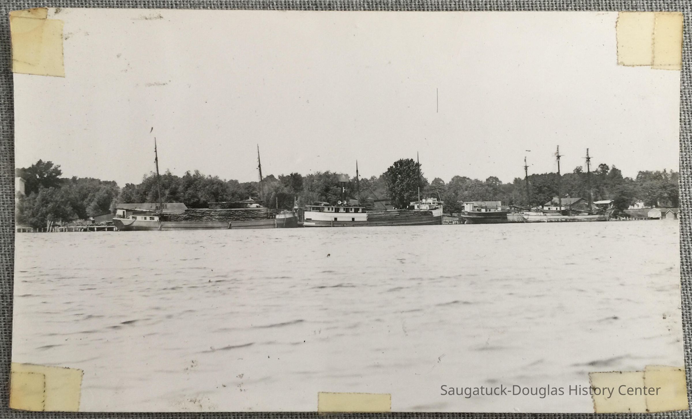 Masted cargo ships loaded with wood picture number 1