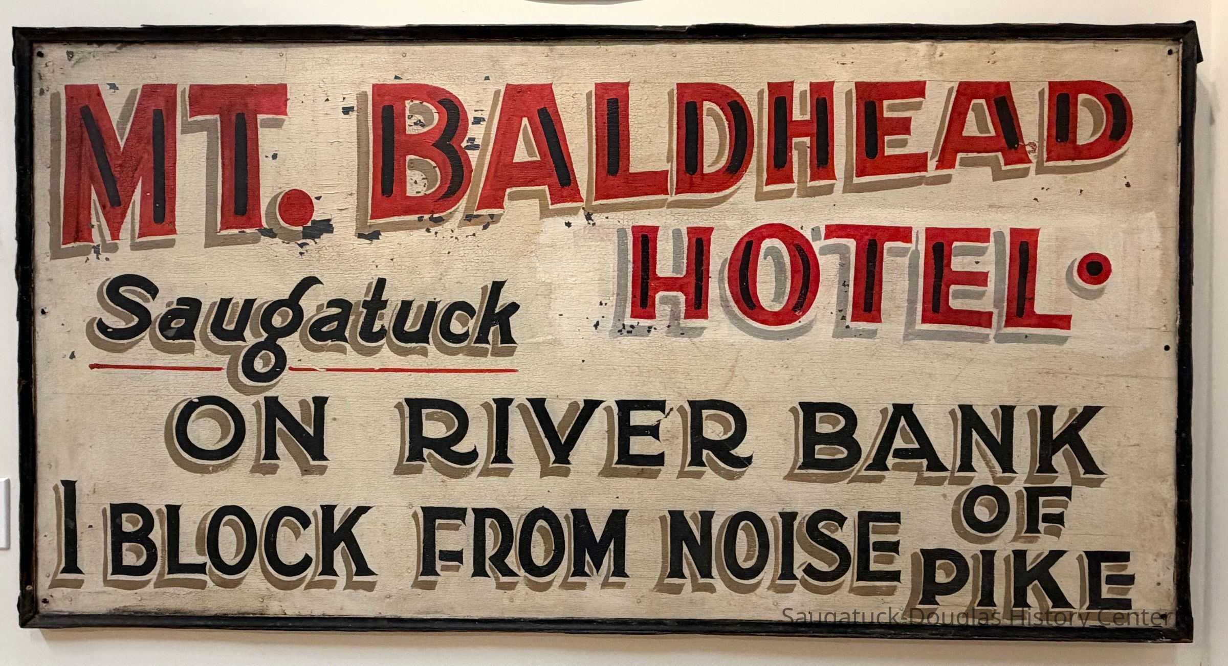          Mt. Baldhead Hotel sign hanging in the History Center's main-floor west gallery in 2026.
   