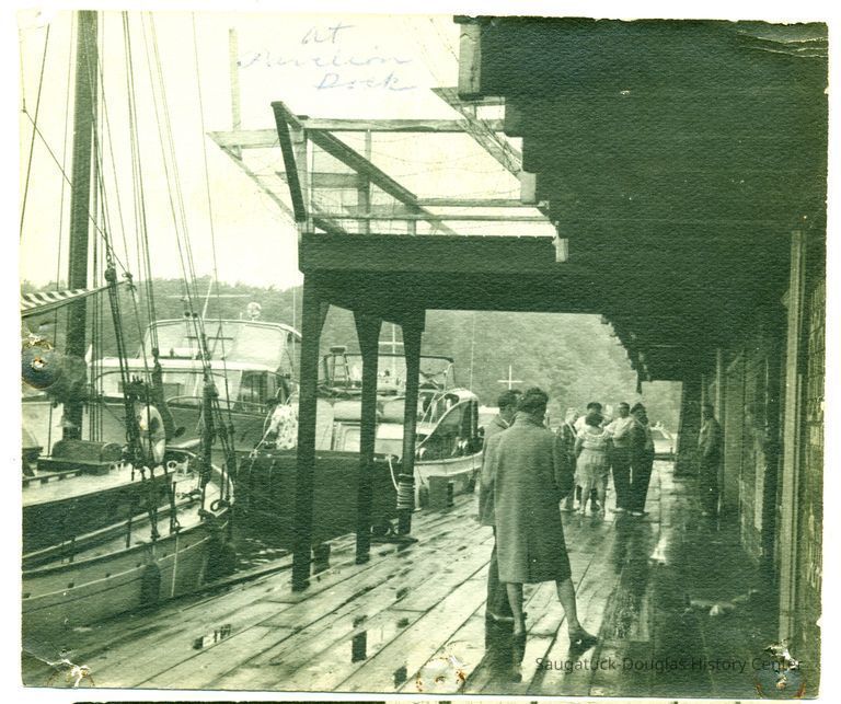 People and sailboats at the Pavilion Dock
