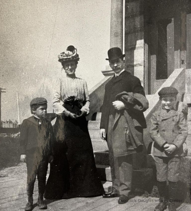          Family thought to be Harvey Lathrop House and Jessie M. (Wright) House with son Walter and Herbert.
   