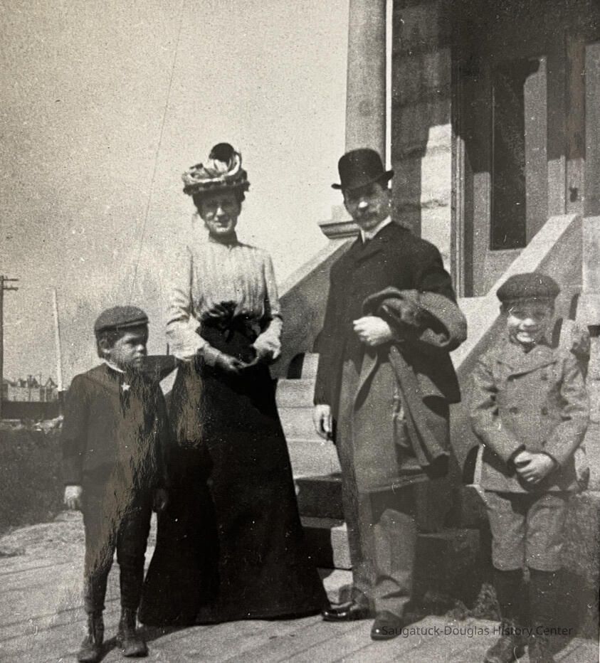 Family thought to be Harvey Lathrop House and Jessie M. (Wright) House with son Walter and Herbert.