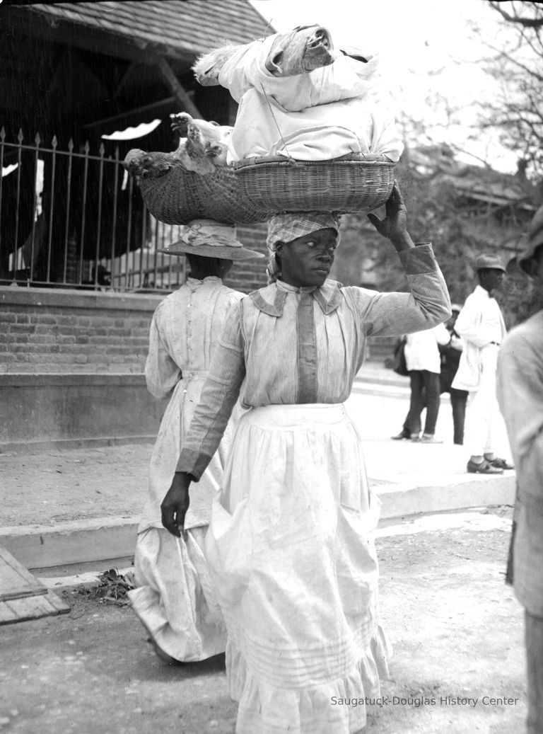          Woman with basket of goods balanced on her head
   