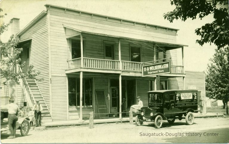          Wolbrink_store; Ganges (Blue Star Highway) It still stands and looks a lot like this. Built before 1870 as a general store—photo from early 1920s. This was Ganges first Post Office in 1879. For a time Lillian Eddy (the mother of Joan, Joyce, Barb, and Betsey), the wife of the postmaster in the 1890s, used the second floor as a private school for local children after they had graduated from high school—a sort of an early junior college. Looks like a bread delivery going on.
Source: Online 