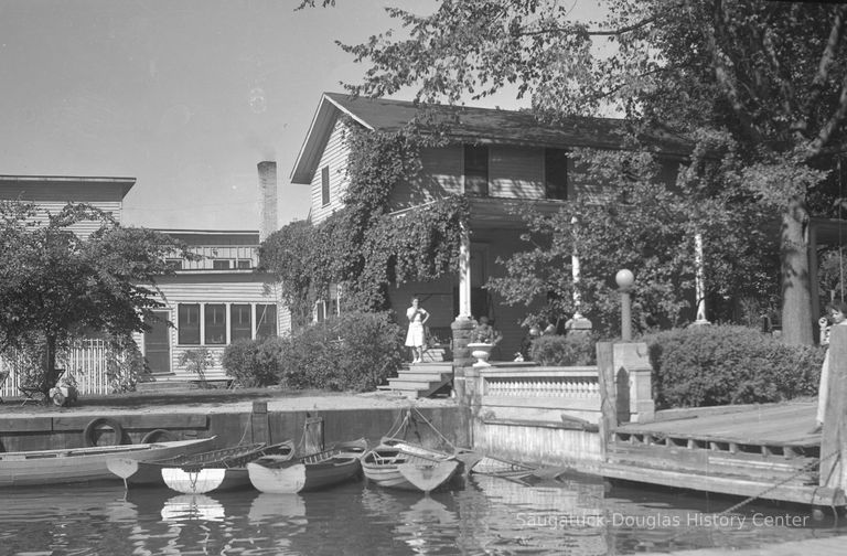          A staffer sneaks a smoke outside the Tourist Home, after it was renamed the Mt. Baldhead Hotel
   