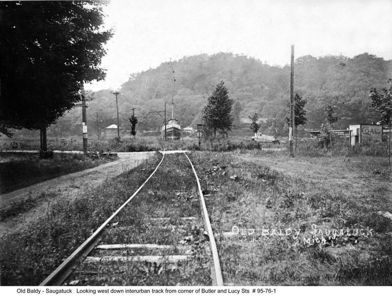          Pumphouse_95_76_1.jpg 1.9MB; A 1906 photo looking down Lucy Street and the Interurban tracks. The photo was taken from where Kirke White's house is at 200 Lucy Street. To the right is a coal shed owned by Dodie Wilson and across the Kalamazoo River to the left is the Pump House, now the Historical Society Museum. In the background is Mt. Baldhead.
-- description by Fred Schmidt
   