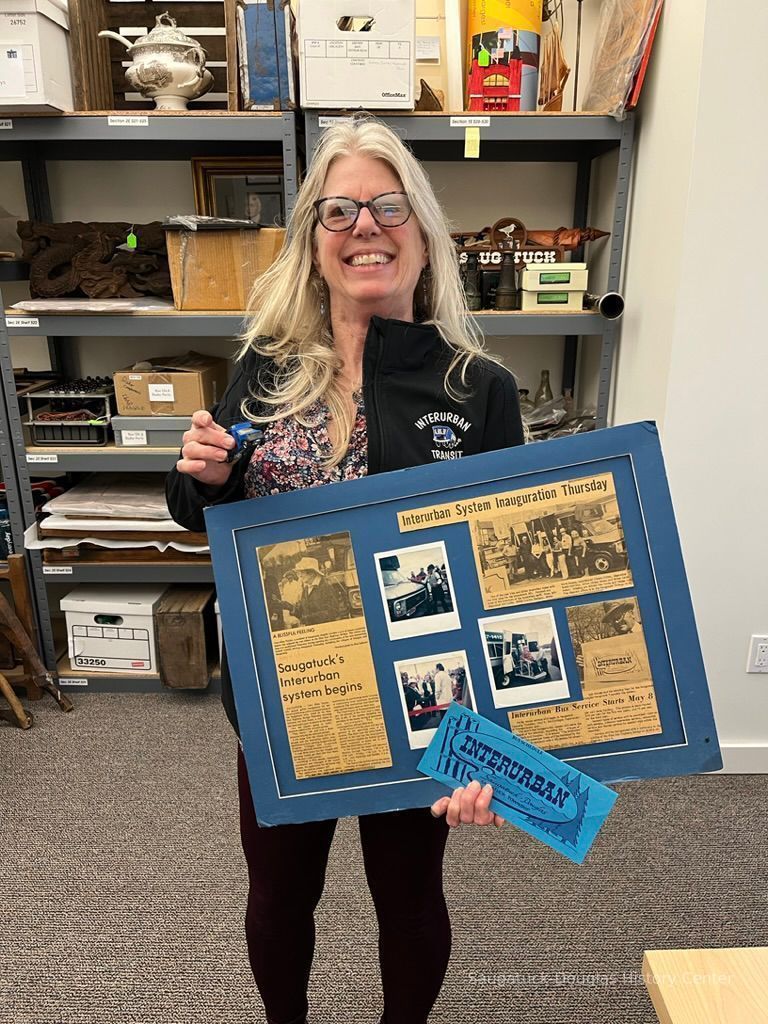          Phyllis Yff of the Interurban Transit Authority holding the three loaned items
   