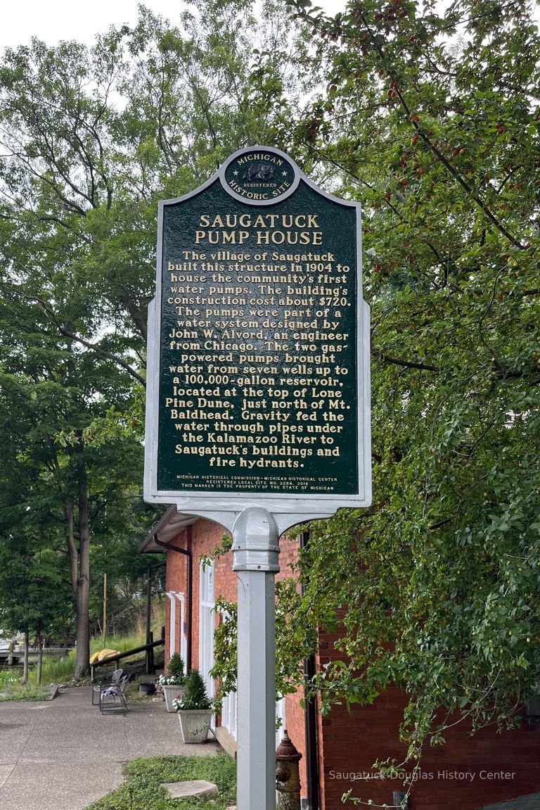          2022; Cast metal Michigan Historic Site marker number L2284 documenting the history of the Saugatuck Pump House. The site entered the national registry in 2015 and the single-post marker was erected in 2016 in the category Industry and Invention (1875-1915)
   