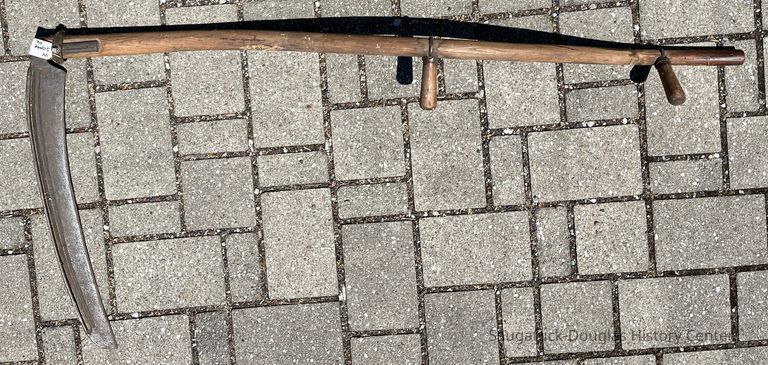          Scythe A has both hand grips
   
