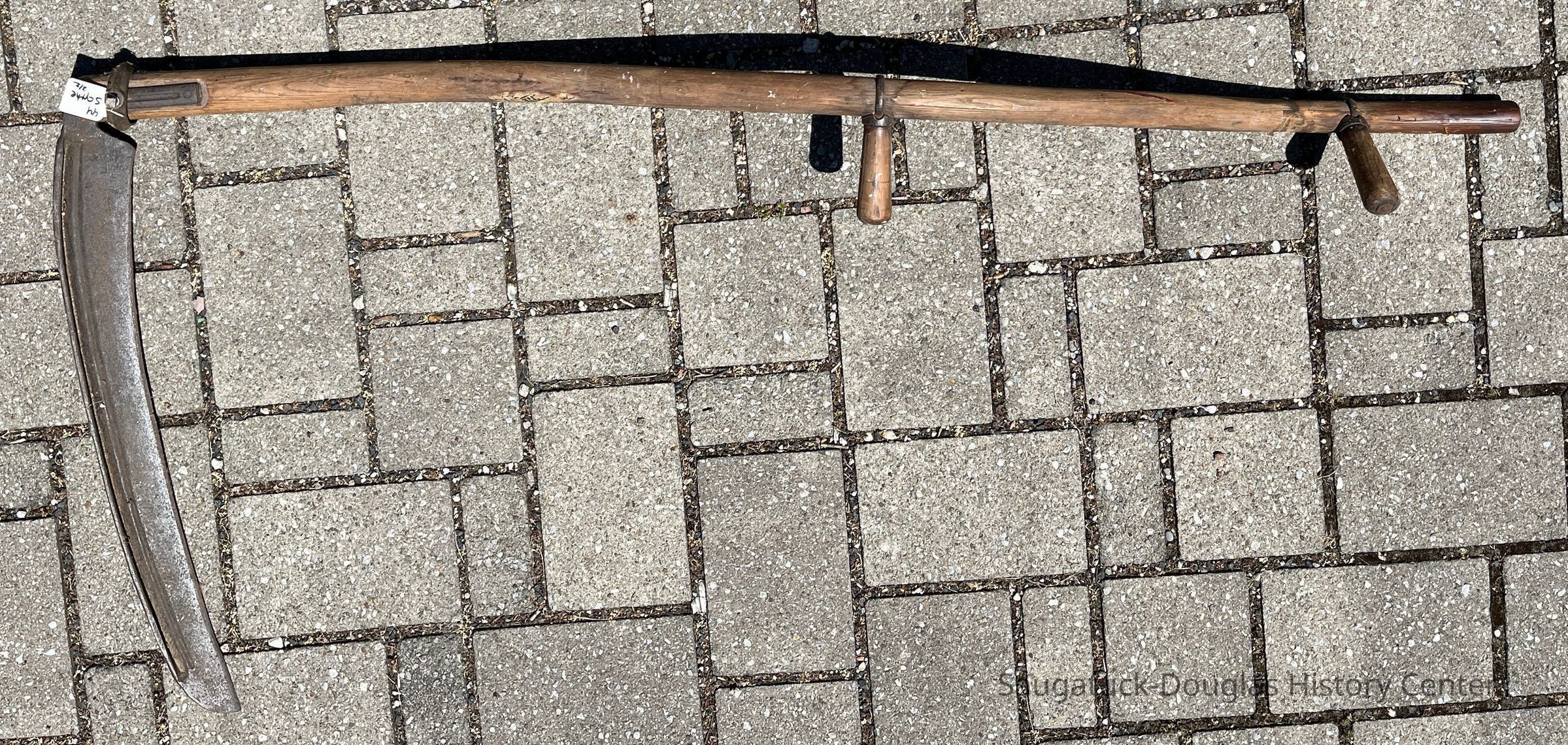          Scythe A has both hand grips
   