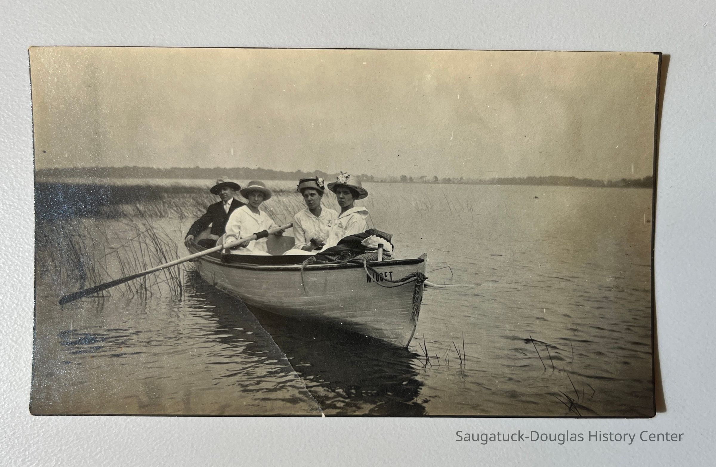 Four people in a rowboat picture number 1