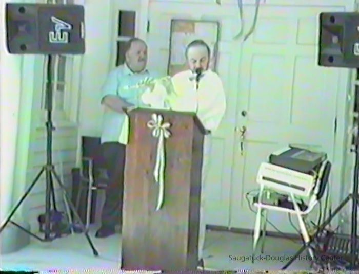         Chuck Lorenz waiting behind Mike Sweeney
   