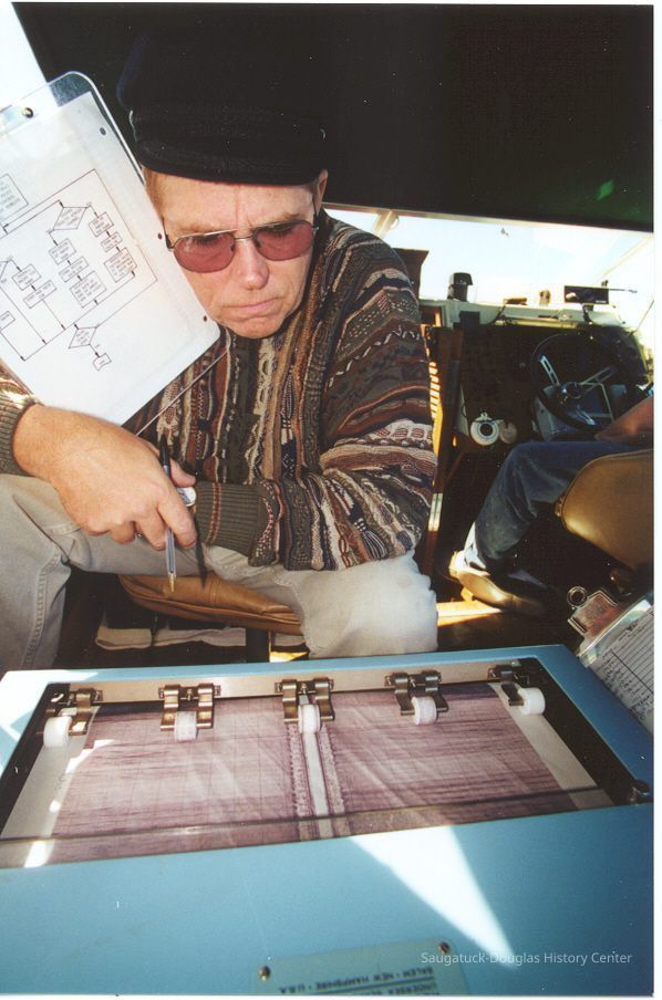 Dave looks on.jpg 533KB; David Trotter reviews side scan on Quest for the Chicora. Photo by Valerie van Heest