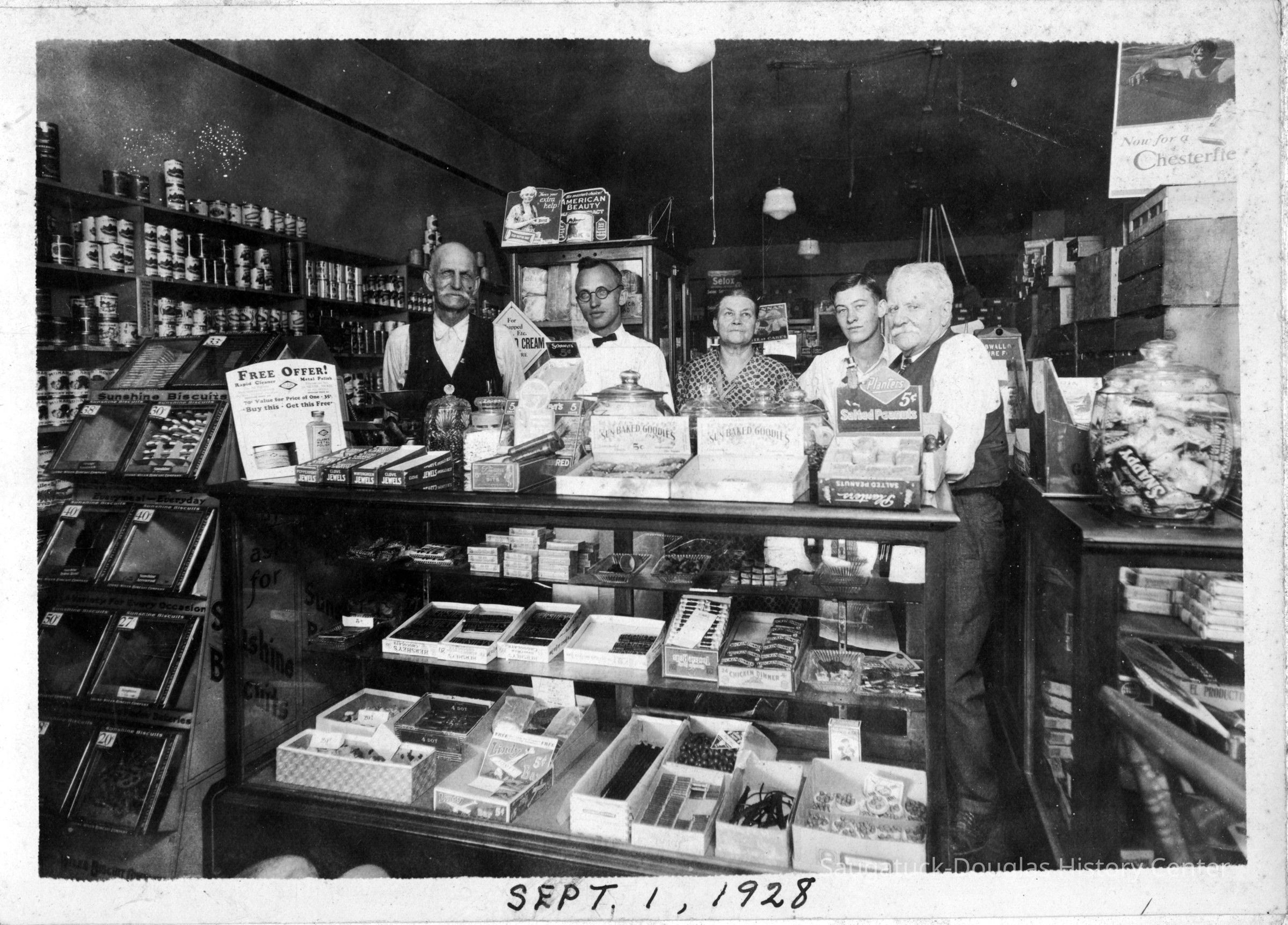          95_89_8_IGA_1928.jpg 1.2MB; Box 31, envelope 95-89-8, Stephen Newnham on the far right. This is the store before it was the IGA.
   