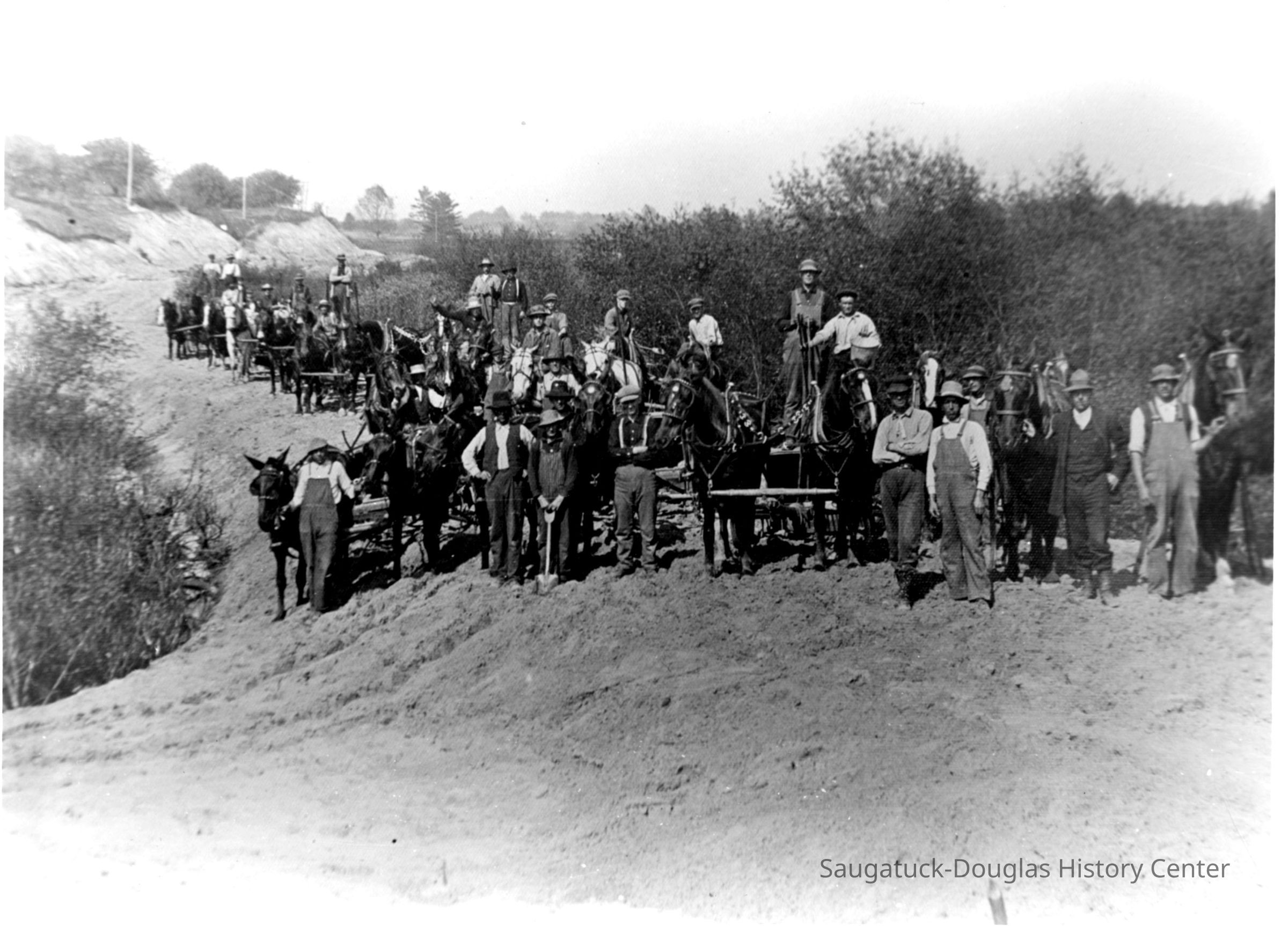 Building_interurban_line.jpg 651KB; Roadwork for Interurban railway, workers with horses. A print of this image is in box 31, envelope 96-105-46. Interurban construction workers digging and grading road bed for laying tracks.