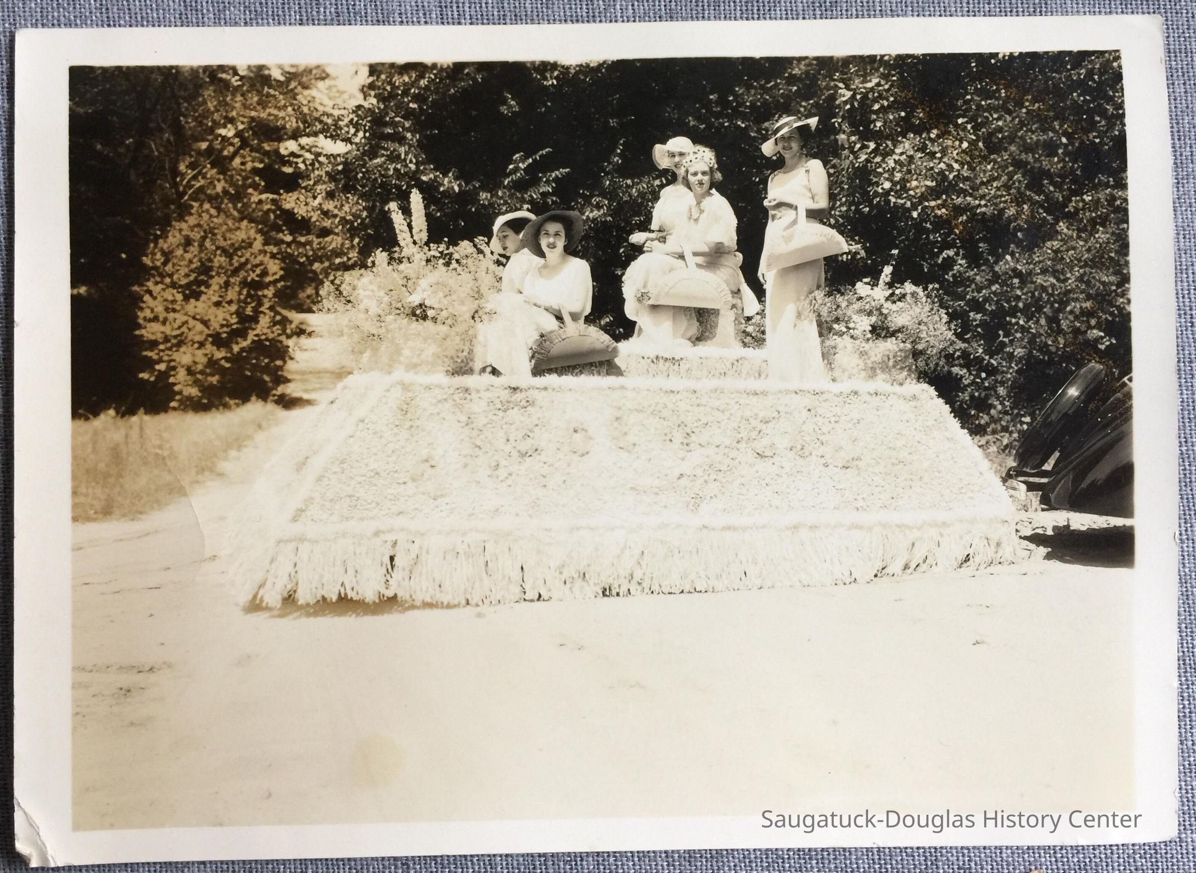Five women posed on a parade float picture number 1