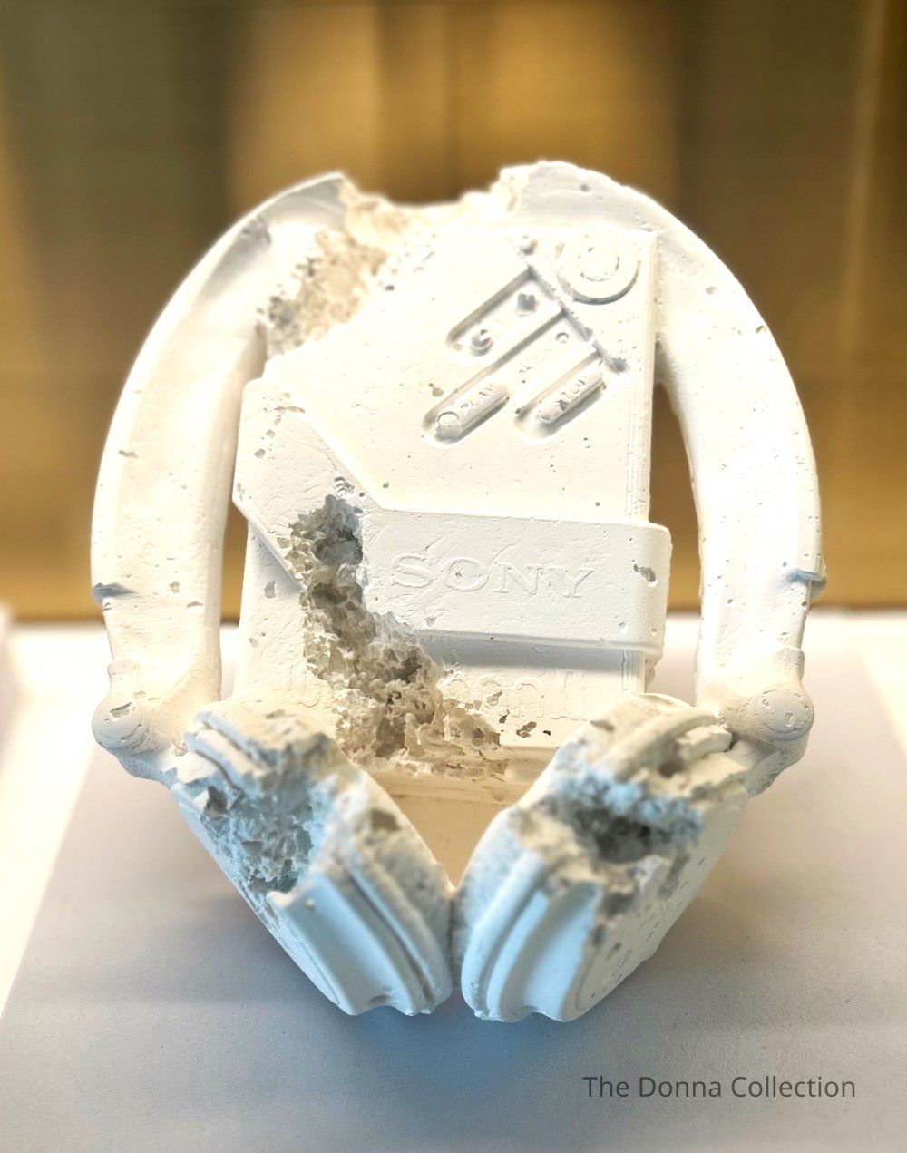 Daniel Arsham makes installations and objects that conjure a Kind of mythical contemporary archeology .In a practice that spams film ,painting,sculpture,and installation-and anplays elements of architecture and performance-the artist distorts recogmizable forms(a cereal box or classical sculpture, for example)