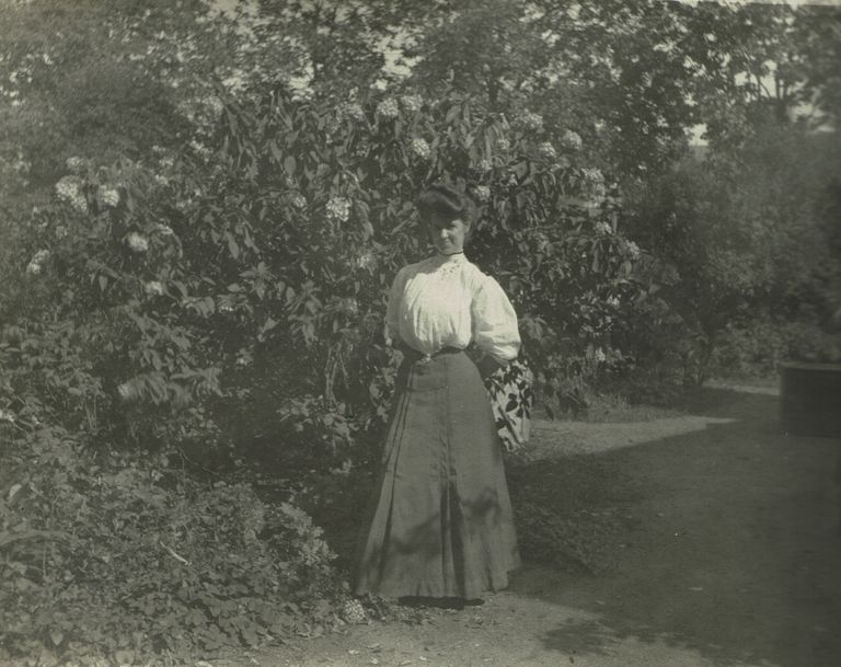          Marshall-Schmidt Album: Woman Standing Near Garden picture number 1
   