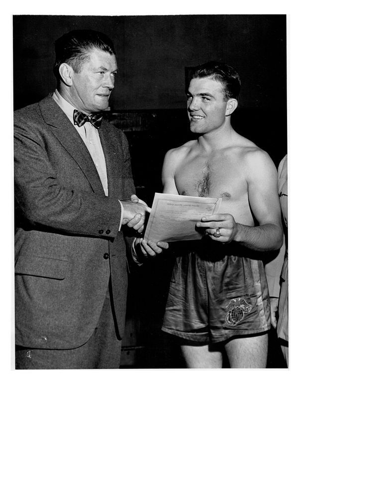          Old Marine Champ Meets the New; International News Photo. Credit: Herbie Scharfman
   