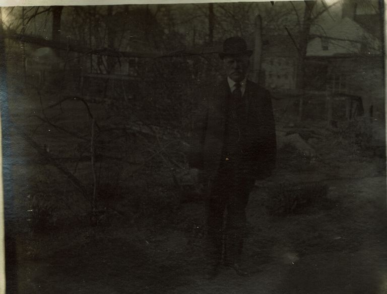          Marshall-Schmidt Album: Man Standing Outside, Factory Chimney in Background picture number 1
   