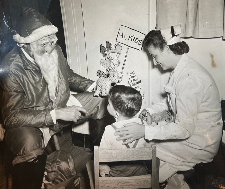          Dunn: Photograph of Bob Dunn visiting a Children's Hospital at Christmastime picture number 1
   