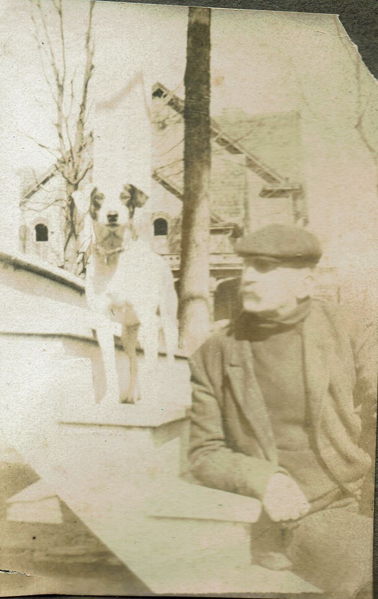          Marshall-Schmidt Album: Frank Marshall Seated on Porch Steps with Dog picture number 1
   
