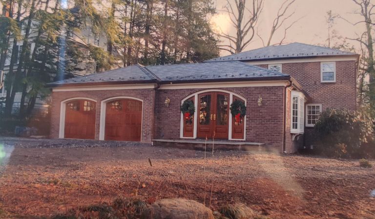          Fire Department: Photograph of house with garage doors similar to a fire station picture number 1
   