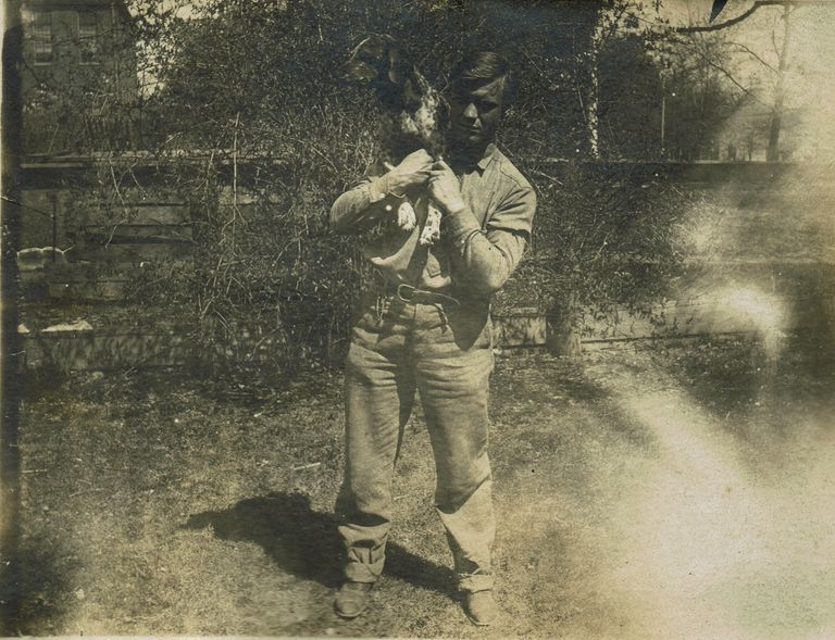          Marshall-Schmidt Photo Album: Boy Holding a Dog on his Shoulders picture number 1
   
