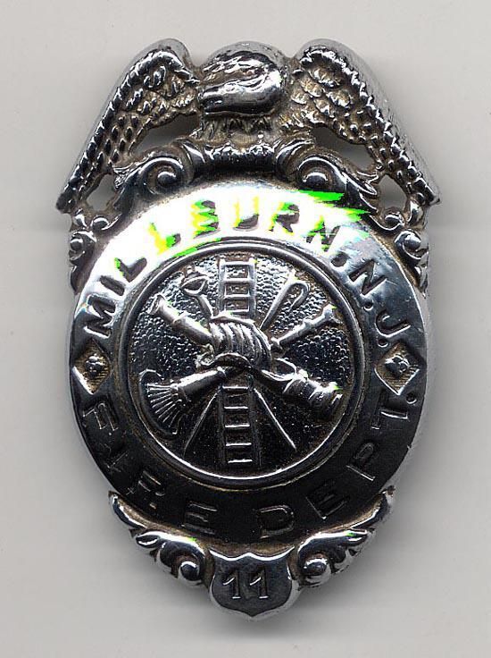          Millburn Fire Dept pin back badge # 11 picture number 1
   