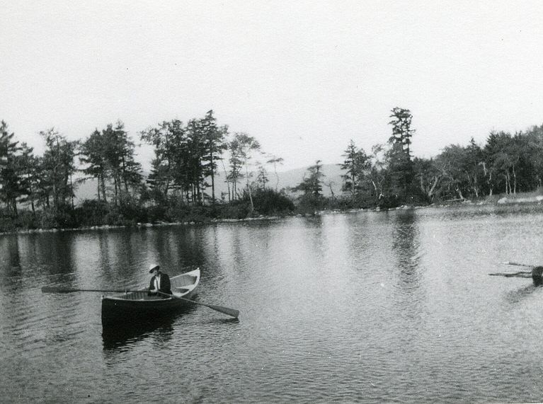          Stewart Hartshorn in a double bowed rowboat; Image Id # 461
   